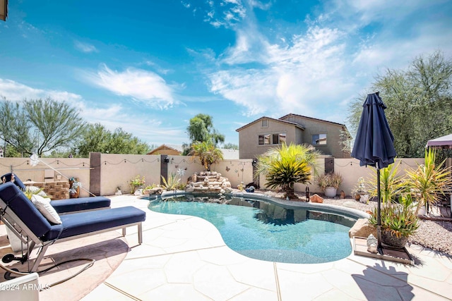 view of swimming pool featuring a patio area