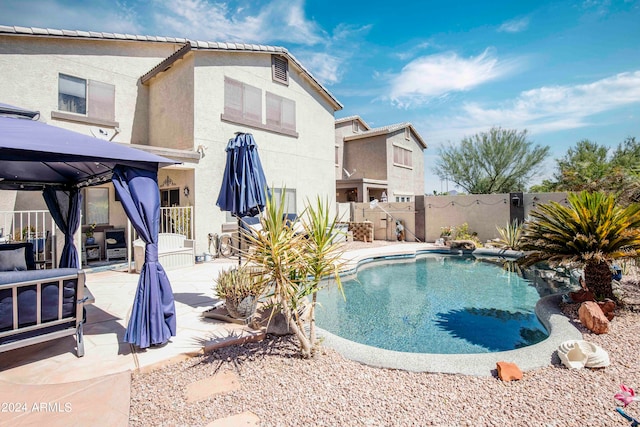 view of pool with a patio and a gazebo