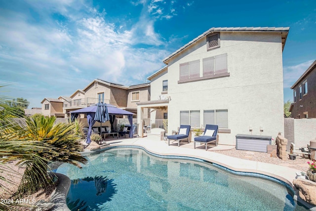 view of pool with a patio area and a gazebo