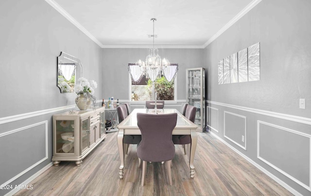 dining space featuring crown molding, hardwood / wood-style floors, and a wealth of natural light