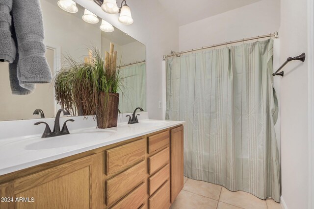 bathroom with tile patterned flooring, vanity, and a shower with shower curtain