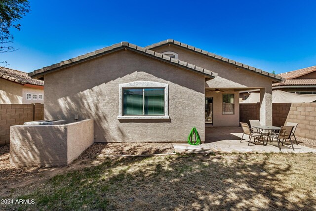 rear view of property with a patio area