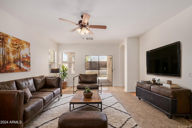 unfurnished room with ceiling fan and light tile patterned flooring