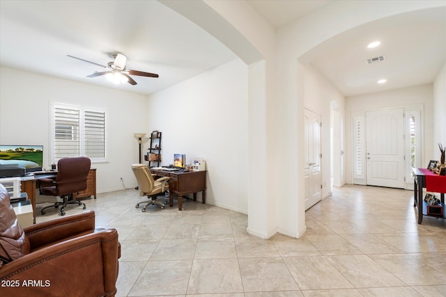 home office featuring arched walkways, recessed lighting, visible vents, a ceiling fan, and baseboards