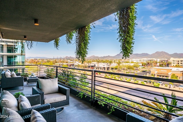 balcony with a mountain view and outdoor lounge area