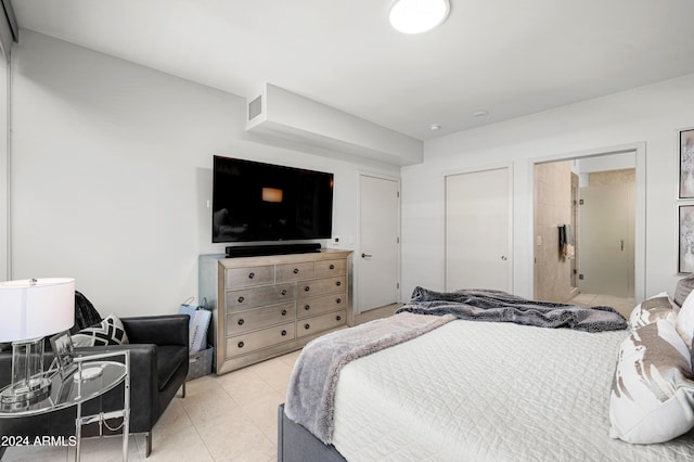 bedroom with light tile patterned flooring