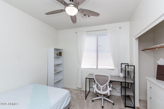 bedroom with light carpet and ceiling fan