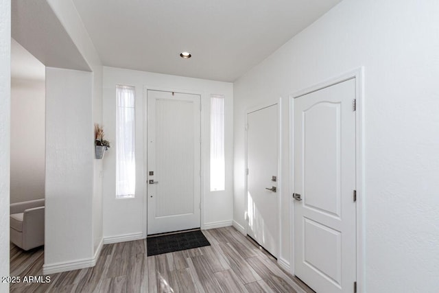 entryway with light hardwood / wood-style floors