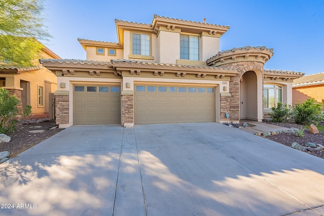 mediterranean / spanish-style house featuring a garage