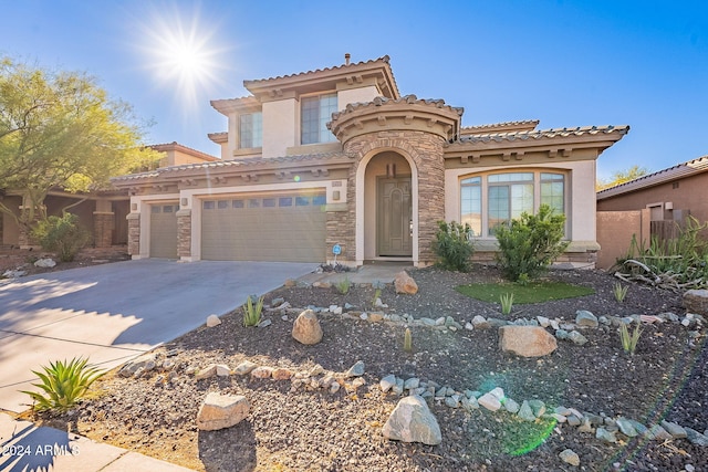 mediterranean / spanish house featuring a garage