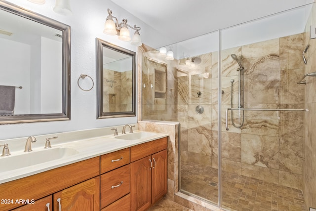 bathroom with vanity and a shower with door