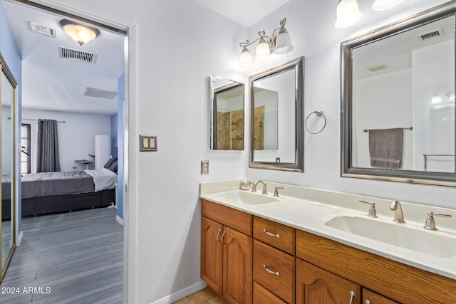 bathroom featuring hardwood / wood-style flooring and vanity