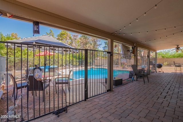 view of patio featuring a fenced in pool