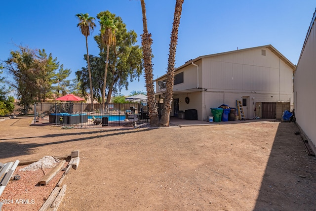 view of yard featuring central AC and a fenced in pool