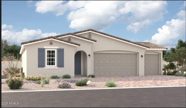 mediterranean / spanish home featuring a garage, decorative driveway, a tiled roof, and stucco siding