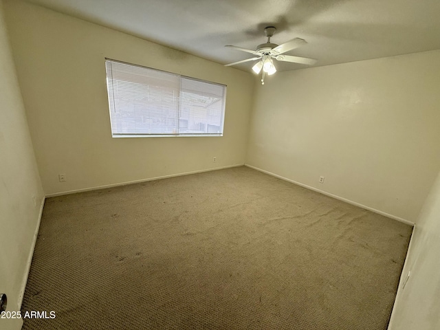 spare room with light carpet and ceiling fan