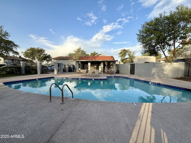 view of swimming pool with a patio