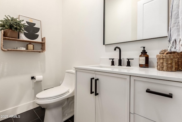 half bathroom featuring toilet, vanity, and tile patterned floors