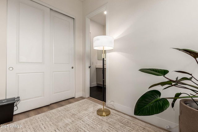 interior space featuring wood finished floors and baseboards