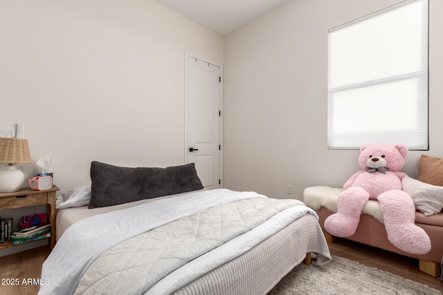 bedroom with wood finished floors