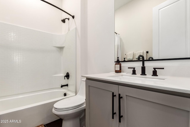 bathroom with toilet, shower / tub combination, and vanity
