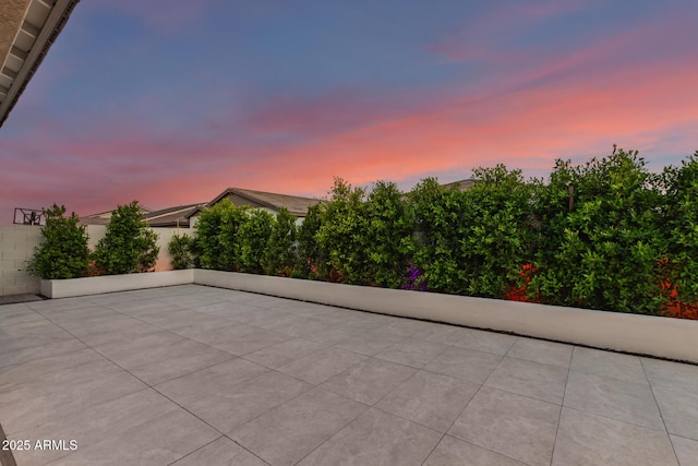 view of patio terrace at dusk