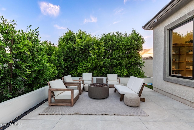 view of patio / terrace with an outdoor fire pit