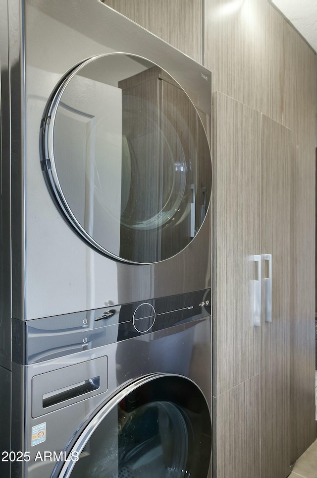 washroom with laundry area and stacked washer and dryer