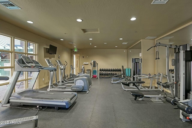 workout area with recessed lighting, visible vents, and a textured ceiling