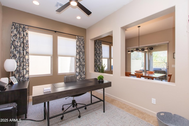 tiled office featuring ceiling fan with notable chandelier