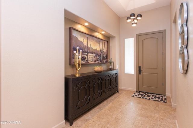 entrance foyer featuring a chandelier