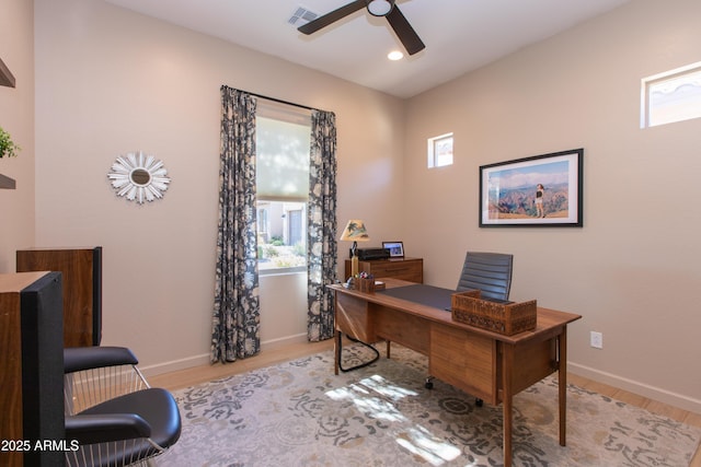 office space with light hardwood / wood-style floors and ceiling fan