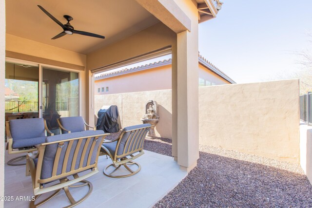 view of patio featuring ceiling fan