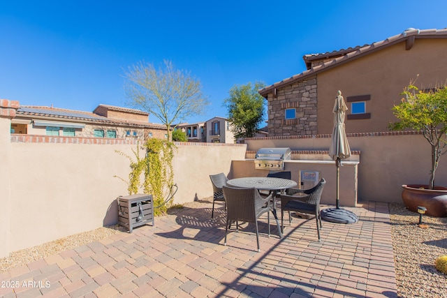 view of patio / terrace with exterior kitchen and grilling area