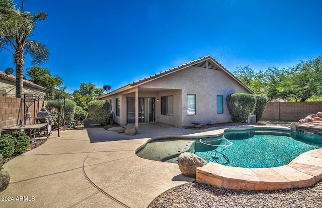 view of swimming pool with central AC unit and a patio area