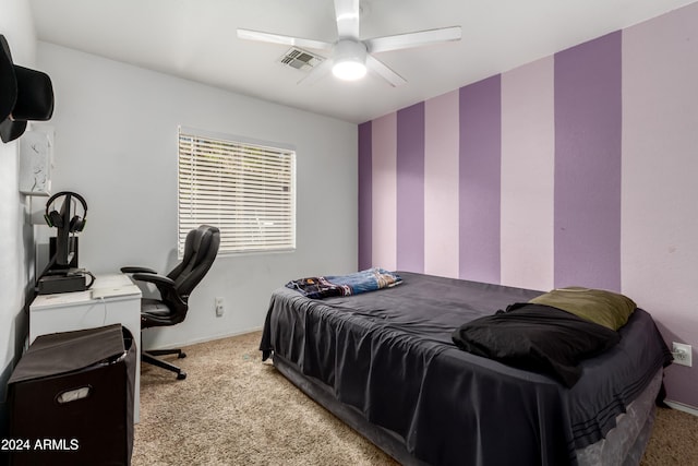 bedroom with light carpet and ceiling fan