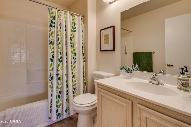 full bathroom with vanity, shower / tub combo with curtain, and toilet