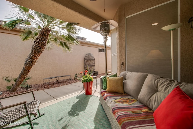 view of patio / terrace featuring ceiling fan