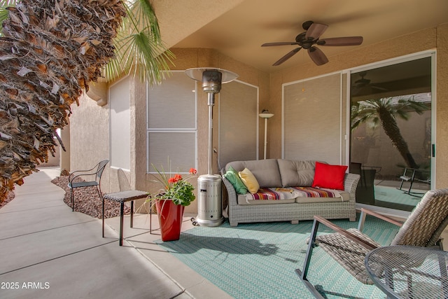 view of patio featuring an outdoor living space and ceiling fan