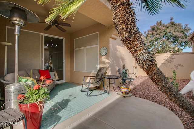 view of patio featuring ceiling fan