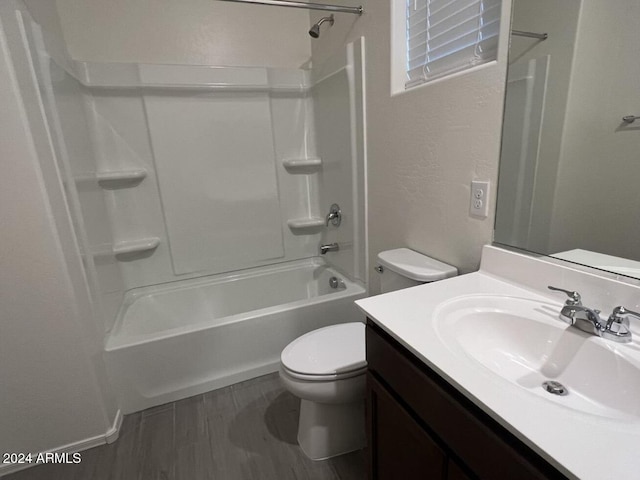 full bathroom featuring bathing tub / shower combination, vanity, and toilet