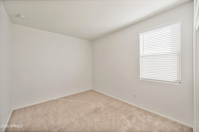 unfurnished room with light colored carpet