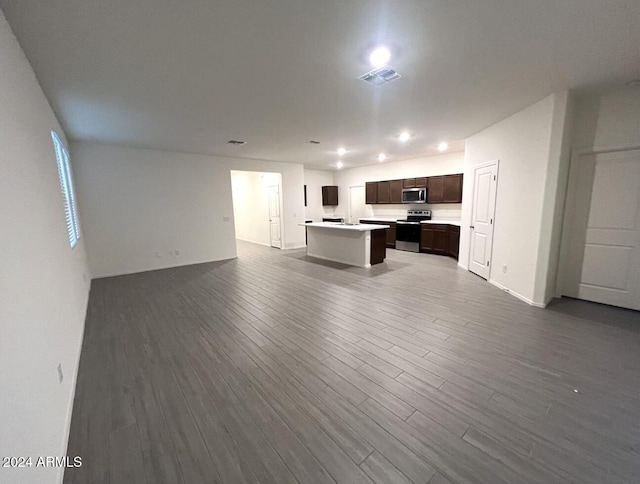 unfurnished living room featuring hardwood / wood-style floors