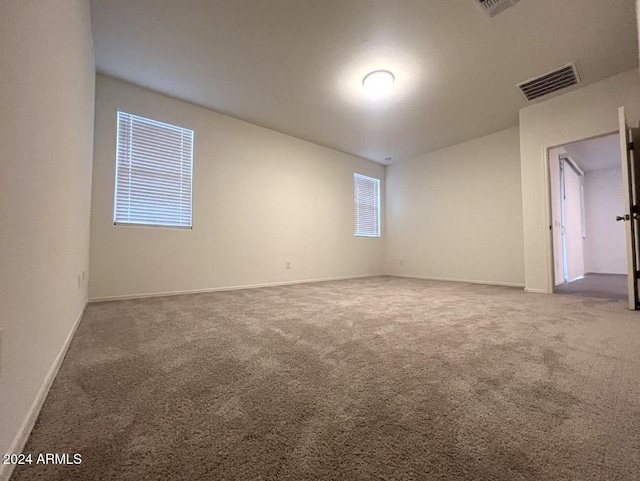 spare room featuring carpet flooring