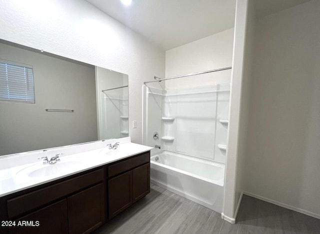 bathroom with vanity, hardwood / wood-style flooring, and shower / bath combination