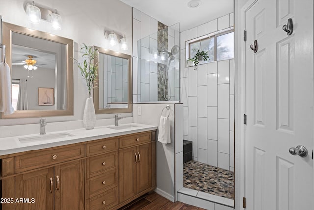 2834 E Devon Ct, Gilbert, AZ 85296 - bathroom with walk in shower, double vanity, wood finished floors, and a ceiling fan