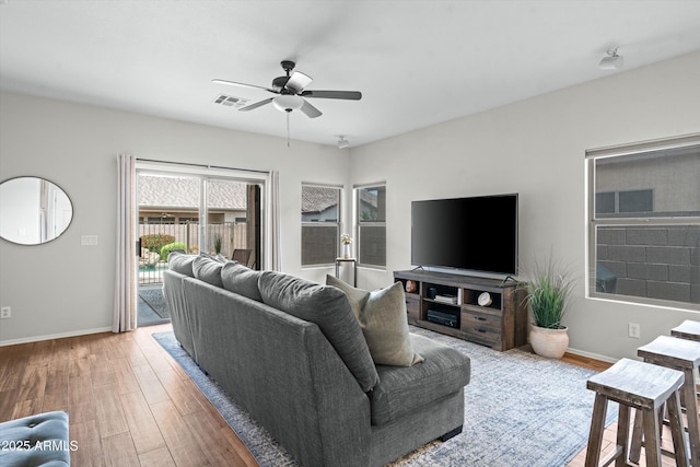 2834 E Devon Ct, Gilbert, AZ 85296 - living area with light wood-style flooring and a ceiling fan