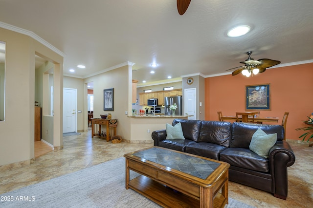 living room with ceiling fan and ornamental molding