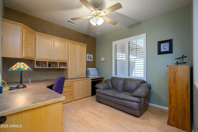 office space with ceiling fan and light wood-type flooring