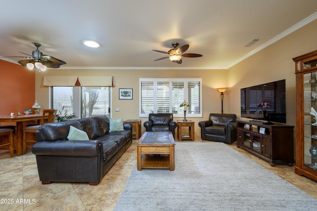 living room featuring ceiling fan and ornamental molding